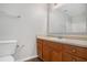 Bathroom with wood vanity, large mirror and shower/tub combo at 705 Chase Ln, Mcdonough, GA 30253