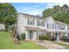 Two-story townhome with green door and driveway at 705 Chase Ln, Mcdonough, GA 30253