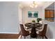 Charming dining area with round table and four chairs at 705 Chase Ln, Mcdonough, GA 30253