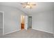 Main bedroom with carpeting, ceiling fan, and private bathroom access at 705 Chase Ln, Mcdonough, GA 30253