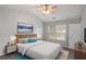 Main bedroom with vaulted ceiling, ceiling fan, and plenty of natural light at 705 Chase Ln, Mcdonough, GA 30253