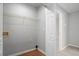 Bright laundry room with washer and dryer hookups, and ample shelving at 705 Chase Ln, Mcdonough, GA 30253