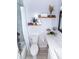 Simple bathroom with white vanity and floating shelves at 2706 Suwanee Se Way # 12, Marietta, GA 30067