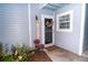 Inviting condo entry with a welcoming sign and well-manicured plants at 2706 Suwanee Se Way # 12, Marietta, GA 30067