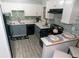Updated kitchen features white cabinets, blue lower cabinets and a breakfast bar at 2706 Suwanee Se Way # 12, Marietta, GA 30067
