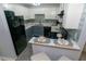 Modern kitchen with white and blue cabinets, quartz countertops, and tile backsplash at 2706 Suwanee Se Way # 12, Marietta, GA 30067