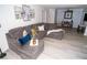 Spacious living room with L-shaped sectional sofa and light gray flooring at 2706 Suwanee Se Way # 12, Marietta, GA 30067