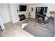 Living room boasts a fireplace, large TV, and ample natural light at 2706 Suwanee Se Way # 12, Marietta, GA 30067