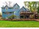 Two-story blue house with a large deck and landscaping at 5073 Verbena Nw Dr, Acworth, GA 30102