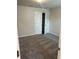 Bedroom with double door closet and neutral carpet at 950 Sunny Lake Dr, Lawrenceville, GA 30043