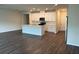 Modern kitchen featuring white cabinets, an island, and stainless steel appliances at 950 Sunny Lake Dr, Lawrenceville, GA 30043