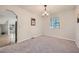 Bright dining area with neutral carpeting and a view of the living room at 6118 Dana Ct, Lithonia, GA 30058