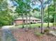 Brick ranch house nestled among trees, showcasing a long driveway at 452 Hightower Ridge Rd, Covington, GA 30014