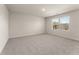 Bedroom with carpeted floor and a window at 8641 Paradise Dr, Douglasville, GA 30134