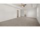 Main bedroom with carpet, ceiling fan and ensuite bathroom at 2415 Autumn Wind Drive - Lot 33, Dacula, GA 30019