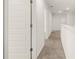 Upstairs hallway with carpet and doors to bedrooms at 2415 Autumn Wind Drive - Lot 33, Dacula, GA 30019