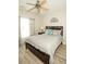 Bright bedroom with ceiling fan, wood flooring and large window at 500 Chestnut Walk, Canton, GA 30114