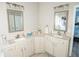 Double vanity bathroom with granite countertops and updated fixtures at 500 Chestnut Walk, Canton, GA 30114