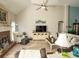 Sunlit living room showcasing hardwood floors and a ceiling fan at 500 Chestnut Walk, Canton, GA 30114
