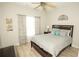 Comfortable bedroom with ceiling fan, window coverings, and wood flooring at 500 Chestnut Walk, Canton, GA 30114