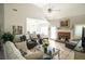 Bright living room with hardwood floors, fireplace, and ample seating at 500 Chestnut Walk, Canton, GA 30114