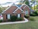Brick home with a landscaped yard and walkway at 500 Chestnut Walk, Canton, GA 30114