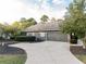 Two-car garage with driveway and landscaping at 500 Chestnut Walk, Canton, GA 30114