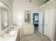 Bathroom features a vanity with granite countertop and access to the bedroom at 500 Chestnut Walk, Canton, GA 30114