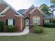 Light blue front door with a wreath on a brick house at 500 Chestnut Walk, Canton, GA 30114