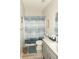Clean bathroom with shower/tub combo, vanity, and tile flooring at 500 Chestnut Walk, Canton, GA 30114