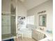 Luxurious bathroom with a large soaking tub and walk-in shower at 500 Chestnut Walk, Canton, GA 30114
