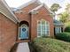 Brick home with a light blue front door and wreath at 500 Chestnut Walk, Canton, GA 30114