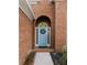 Light blue front door with a wreath, brick entryway at 500 Chestnut Walk, Canton, GA 30114