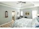 Main bedroom with king bed, ensuite bath access, and ceiling fan at 500 Chestnut Walk, Canton, GA 30114