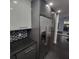 Modern kitchen with stainless steel appliances and dark gray cabinets at 375 Ralph Mcgill Blvd # 505, Atlanta, GA 30312
