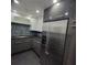 Modern kitchen features stainless steel appliances and dark gray cabinetry at 375 Ralph Mcgill Blvd # 505, Atlanta, GA 30312