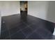 Large living room with dark tile floors and abundant natural light at 375 Ralph Mcgill Blvd # 505, Atlanta, GA 30312