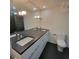 Modern bathroom with double sinks and dark tile floors at 375 Ralph Mcgill Blvd # 505, Atlanta, GA 30312