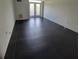 Spacious living room with dark tile floors and access to a balcony at 375 Ralph Mcgill Blvd # 505, Atlanta, GA 30312