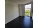 Bright bedroom with large window and dark tile floors at 375 Ralph Mcgill Blvd # 505, Atlanta, GA 30312