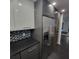 Modern kitchen with stainless steel appliances and sleek dark gray cabinets at 375 Ralph Mcgill Blvd # 505, Atlanta, GA 30312