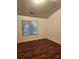 Spacious bedroom with hardwood floors and a large window at 835 Amelia Grove Ln, Lawrenceville, GA 30045