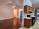 Open living room with hardwood floors and a view of the kitchen at 835 Amelia Grove Ln, Lawrenceville, GA 30045