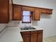 Bright kitchen with double sink, ample cabinets, and neutral countertops at 835 Amelia Grove Ln, Lawrenceville, GA 30045