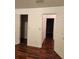 Bedroom with hardwood floors and access to other rooms at 835 Amelia Grove Ln, Lawrenceville, GA 30045