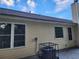 Tan vinyl sided house with a new air conditioning unit at 835 Amelia Grove Ln, Lawrenceville, GA 30045