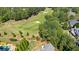 Aerial view of golf course and upscale homes in a community at 2770 Pebble Hill Trce, Duluth, GA 30097