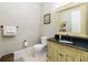 Elegant powder room with dark vanity and decorative mirror at 2770 Pebble Hill Trce, Duluth, GA 30097