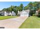 Two-story house with a driveway and surrounding trees at 12227 Cypress Ln, Fayetteville, GA 30215