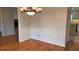 Elegant dining room featuring hardwood floors and chandelier at 1205 Bramlett Creek Pl, Lawrenceville, GA 30045